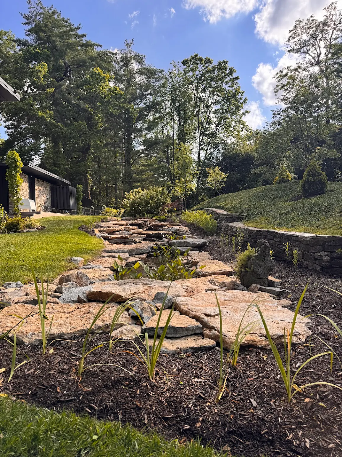 Natural stone stream and stepping stones along hillside